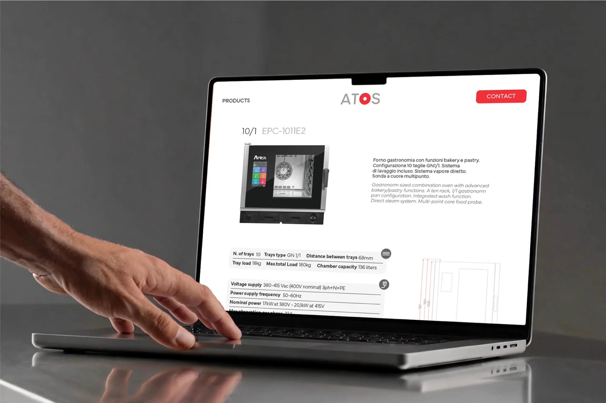 A person’s hand interacts with a laptop displaying a product page for an ATOS combination oven with bakery and pastry functions, detailed specifications, and a contact button.