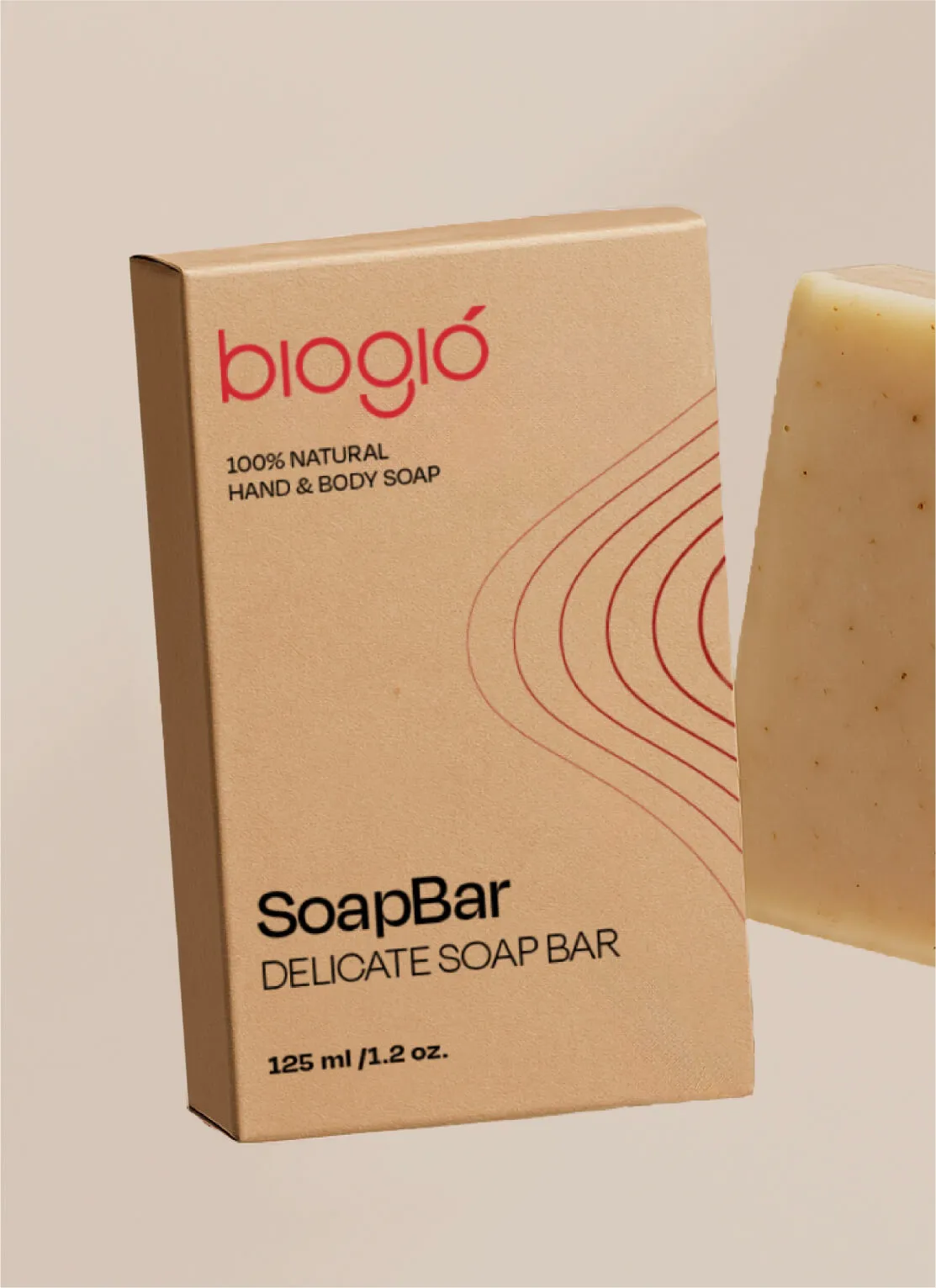 A beige rectangular box of biogio 100% natural hand and body soap next to a light tan soap bar with small dark specks, labeled SoapBar Delicate Soap Bar 125 ml / 1.2 oz.
