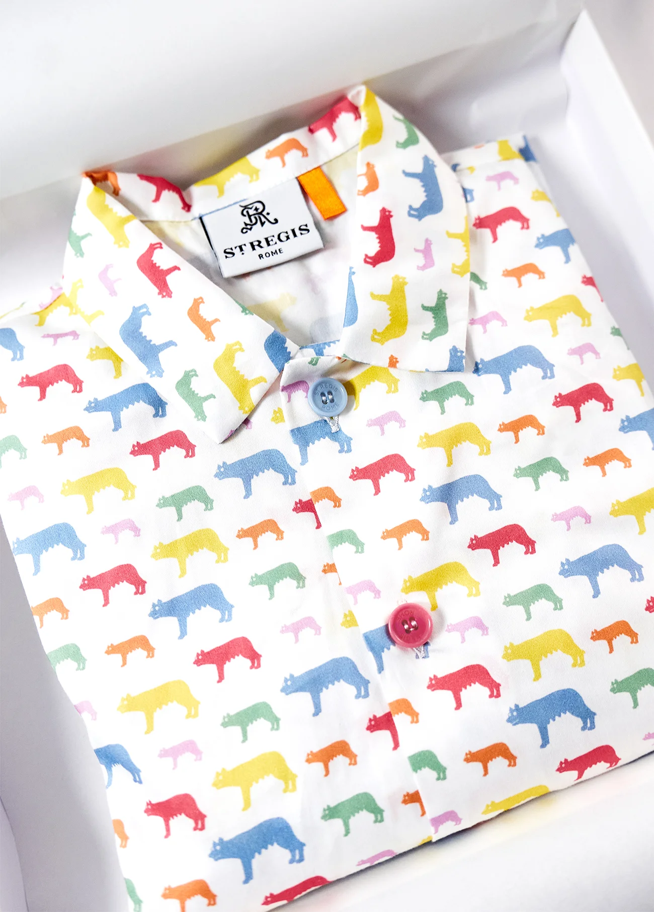 St. Regis Hotel white pajama with colored wolves in collaboration with CHECCOLUZI
