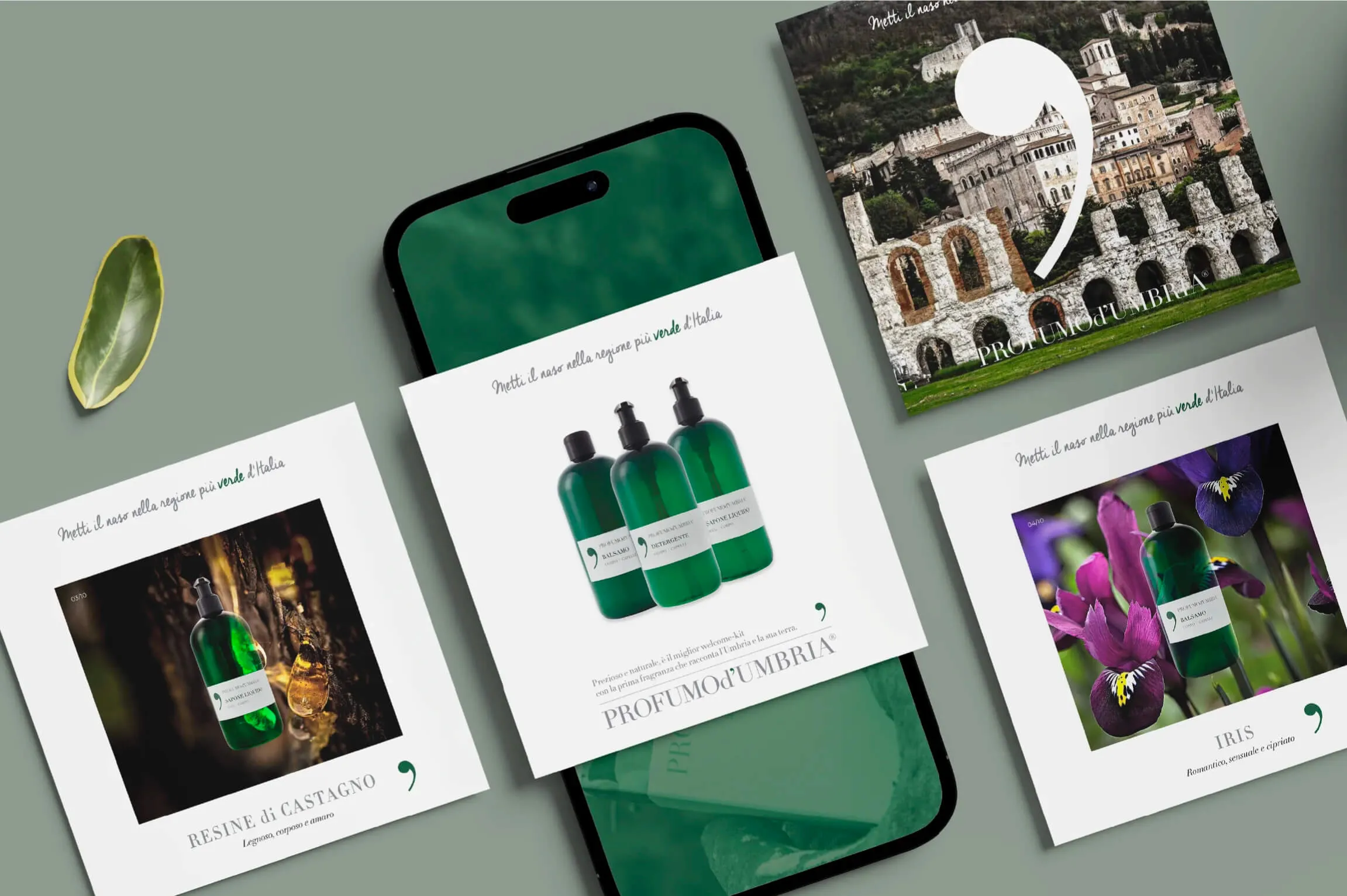 Four square promotional cards for Profumo d’Umbria cosmetics arranged around a smartphone on a green surface, featuring images of green bottles with labels, natural elements like chestnut resin, purple irises, an ancient stone structure, and text in Italian emphasizing the brand’s green regional roots.