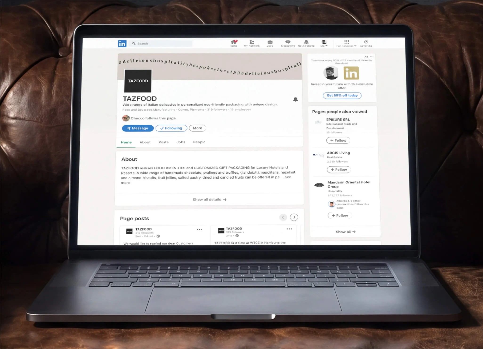 Laptop on brown leather chair showing LinkedIn company profile page for TAZFOOD, a food and beverage manufacturer specializing in Italian delicacies and customized gift packaging.