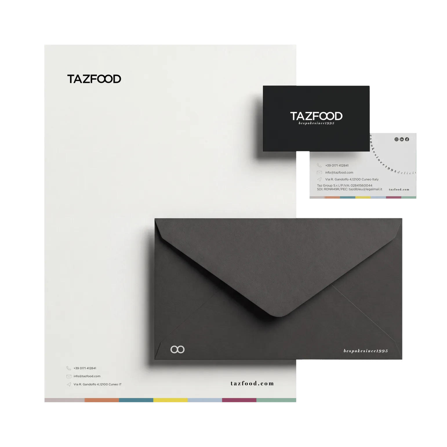 Stationery set for TAZFOOD including a white letterhead with logo and contact details, a black envelope with minimalist symbols and text, and front and back of a business card with the TAZFOOD logo and company contact information.
